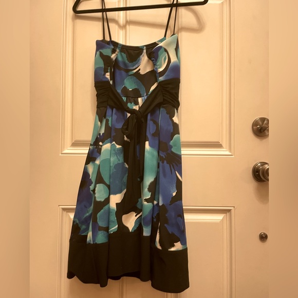 Black floral dress with rouched bodice and a black belt underneath.  Size 12. - Picture 5 of 7